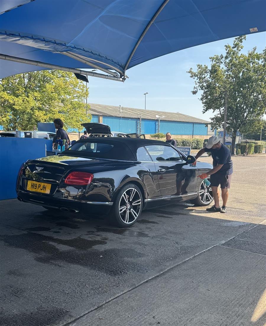 A car being polished by hand at Springwood Hand Car Wash