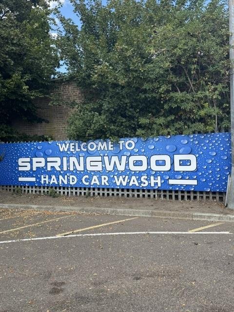 The Welcome to Springwood Hand Car Wash sign at the site entrance